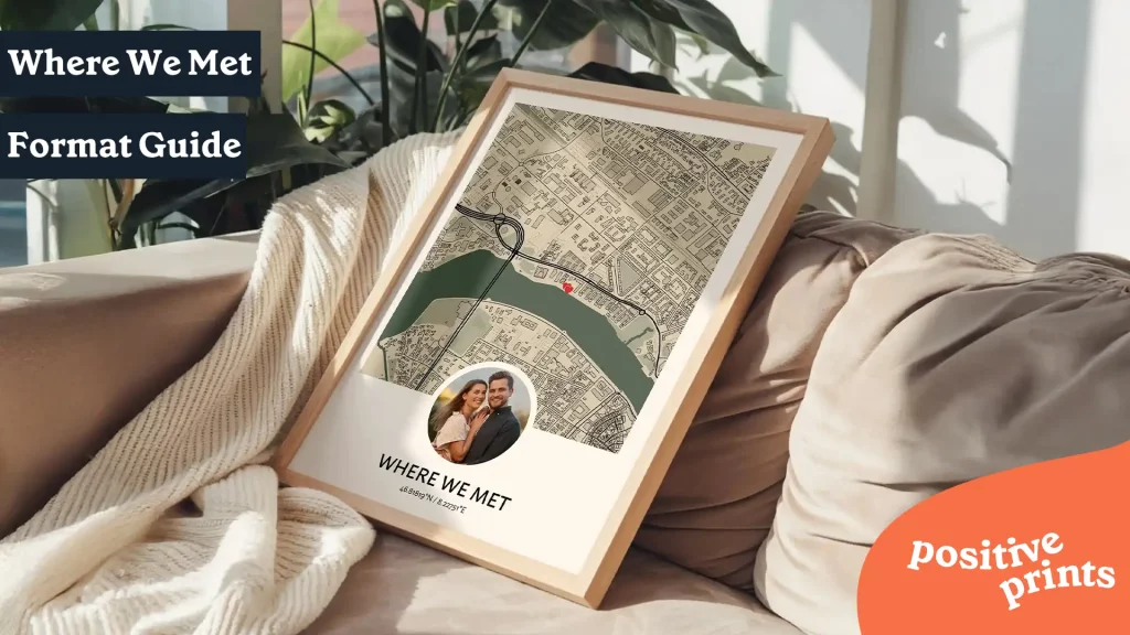 Framed Where We Met map print with custom location, couple photo, and coordinates displayed on a cozy sofa in a sunlit living room.
