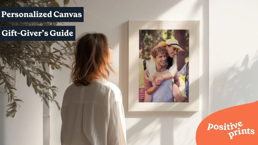Woman looking at a personalized canvas print featured in a gift guide for personalized canvas prints.
